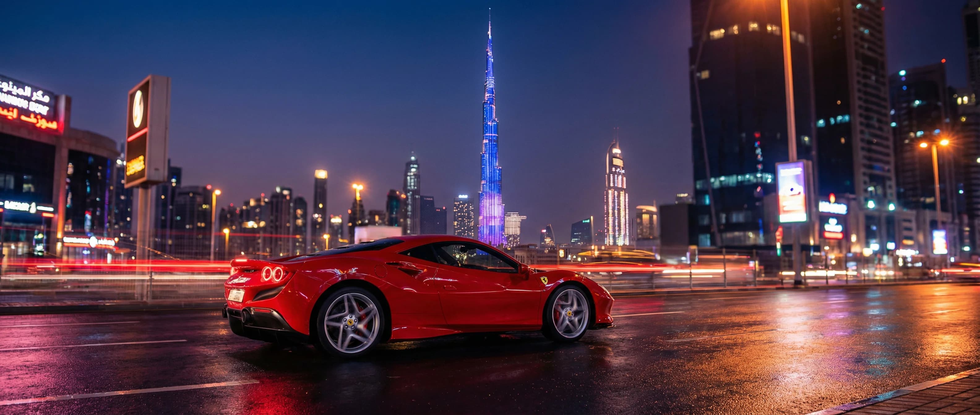 Red Ferrari F8 on Sheikh Zayed Road with Burj Khalifa at night